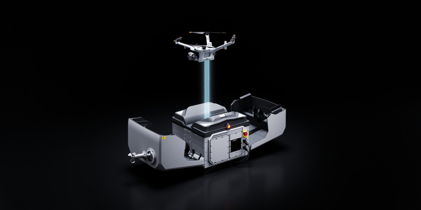 DJI Dock 4 mit geöffneten Klappen, über dem die Matrice 5TD zum Landen ansetzt, vor dunklem Hintergrund