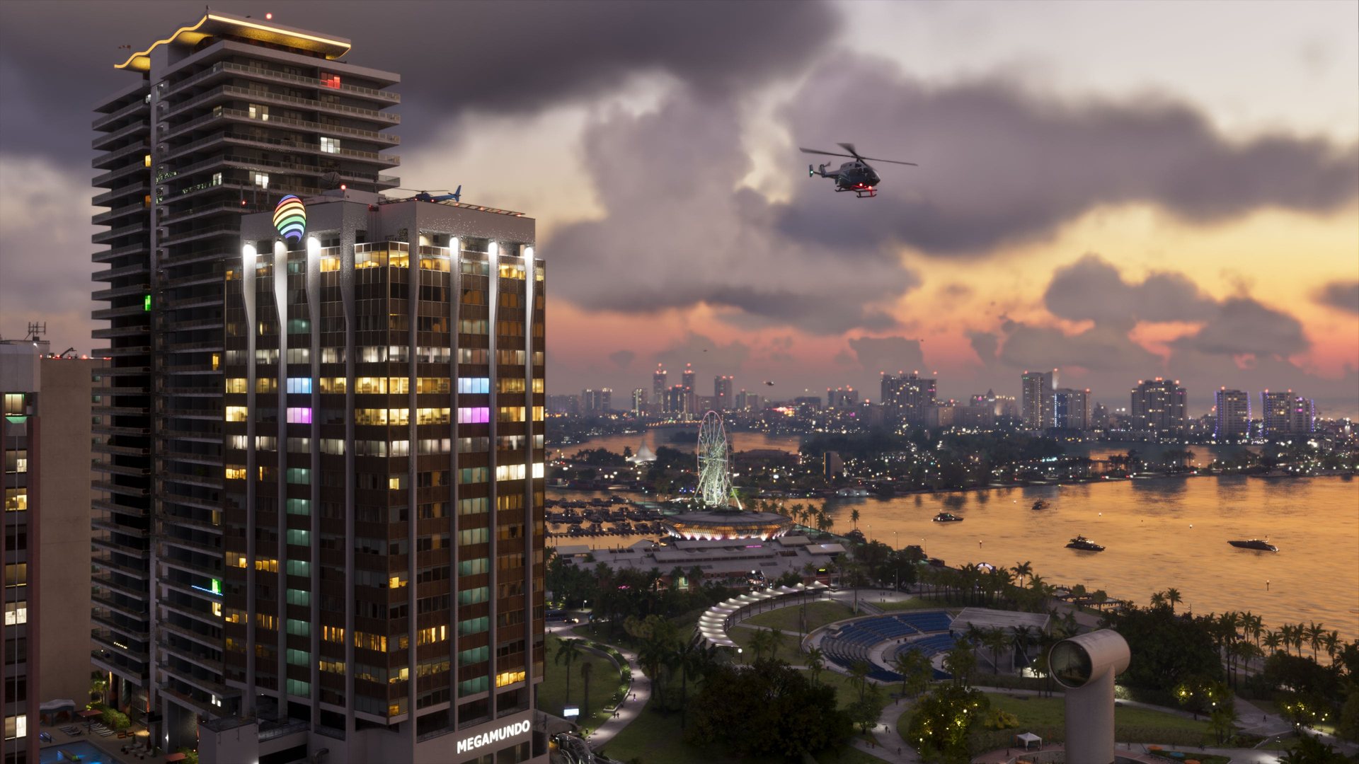 Offizielles GTA-VI-Stadtmotiv mit beleuchtetem Hochhaus, Wasserflächen und Hubschrauber vor einem Abendhimmel